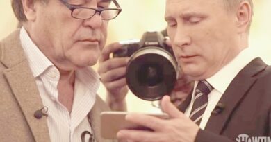 Two men in suits, one with glasses and a stethoscope, lean in to view a smartphone while another holds a camera; Showtime watermark in corner.