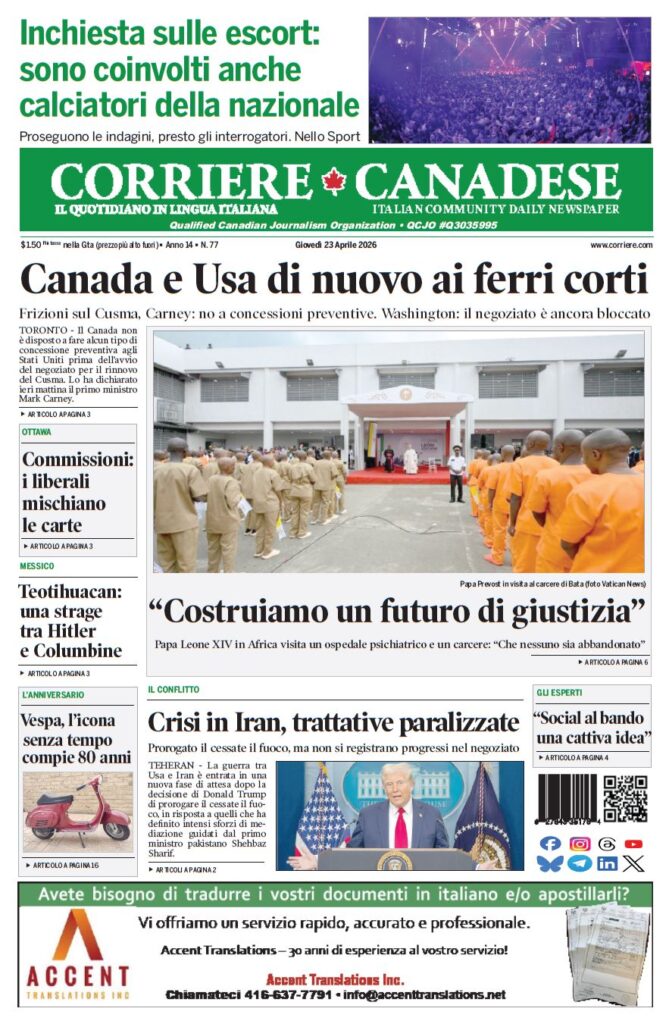 Front page of Corriere Canadese with bold headline; photo shows uniformed prisoners lined up outside a building for a ceremony.