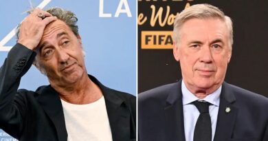 Two middle-aged men in suits pictured side by side at separate events; left man is touching his head with a puzzled expression, wearing a black jacket and white shirt; right man wears a dark suit and tie against a dark backdrop.