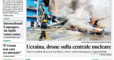 Front page of Corriere Canadese newspaper with a green masthead and bold Italian headlines, featuring a large photo of a burning wreck and firefighters amid smoke.