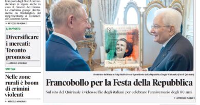 Front page of Corriere Canadese newspaper with a large green headline about tariffs, a central photo of two men in suits beside a commemorative stamp, and a small sports photo of a cyclist at the top.