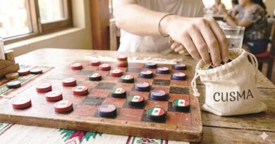Person reaches for circular game pieces on a wooden board game; a cloth bag labeled CUSMA sits nearby.