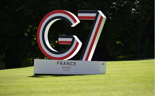 Large G7 sculpture on a green lawn with a white pedestal reading FRANCE EVIAN 2026.