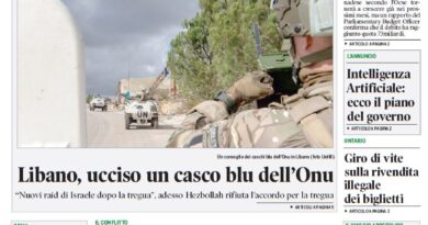 Front page of Corriere Canadese newspaper with bold headlines about debt and recovery, and a photo of a UN convoy in Lebanon beneath the main story.