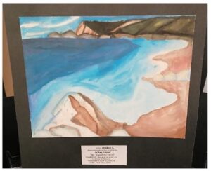Framed painting of a blue ocean coastline with a sandy beach and distant rocky headland.