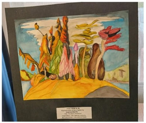 Abstract landscape painting featuring tall multicolored rock shapes on a yellow hill under a blue sky, framed in black.
